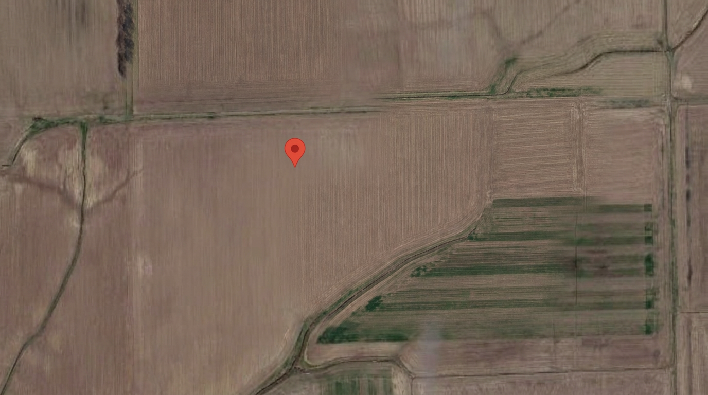 Satellite view of the monitored field with the sensor location marked